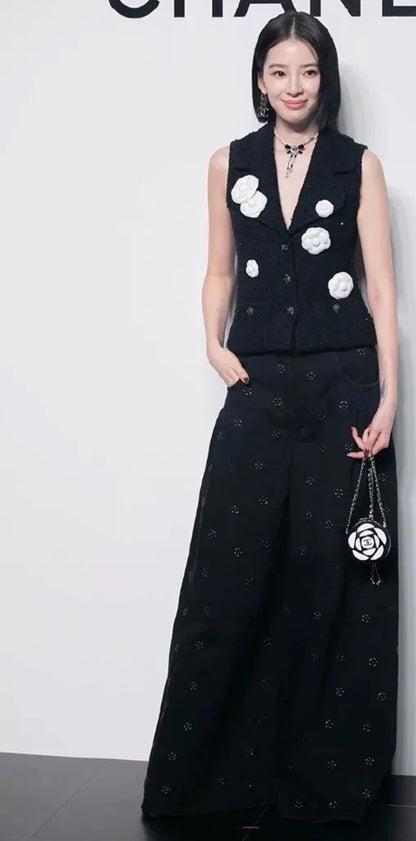 Chanel 23K black camellia wide-leg denim pants