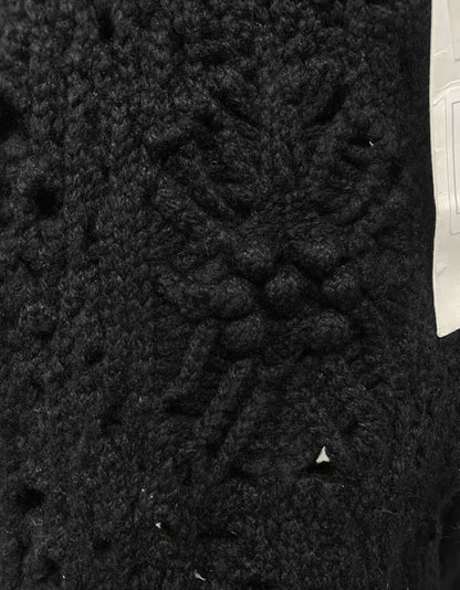 Chanel black camellia knit trousers