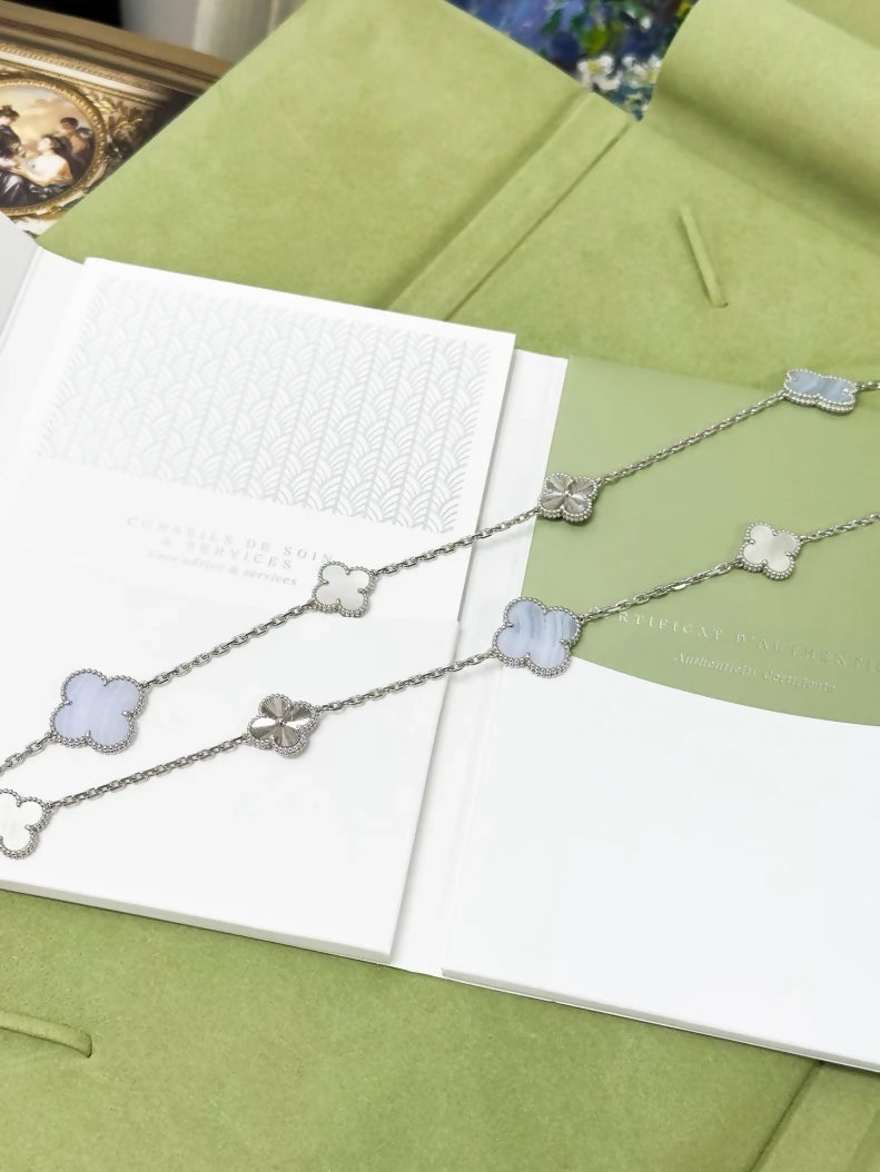 Van Cleef 
Arpels Magic Alhambra long necklace in white gold, mother of pearl and chalcedony