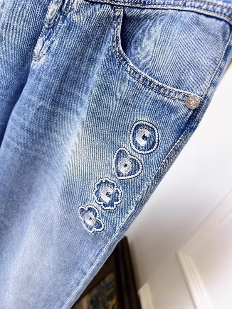 Chanel 25M blue jeans with embroidered lettering