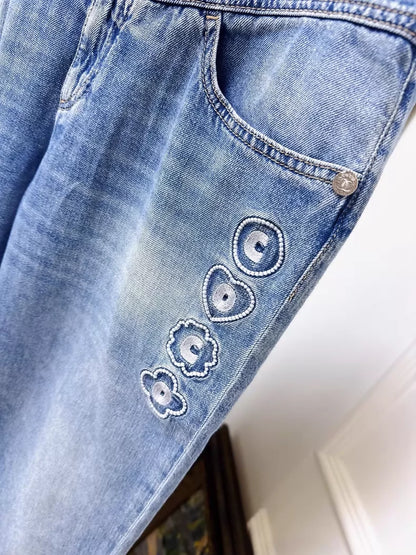 Chanel 25M blue jeans with embroidered lettering