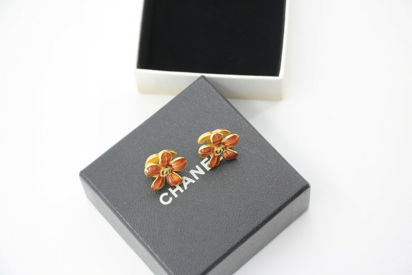 Chanel 03P Enamel Orange Five-Petal Flower Green CC Stacked Earrings