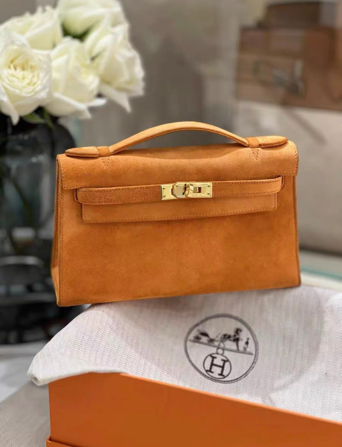 HERMES Veau Doblis Kelly Pochette Orange