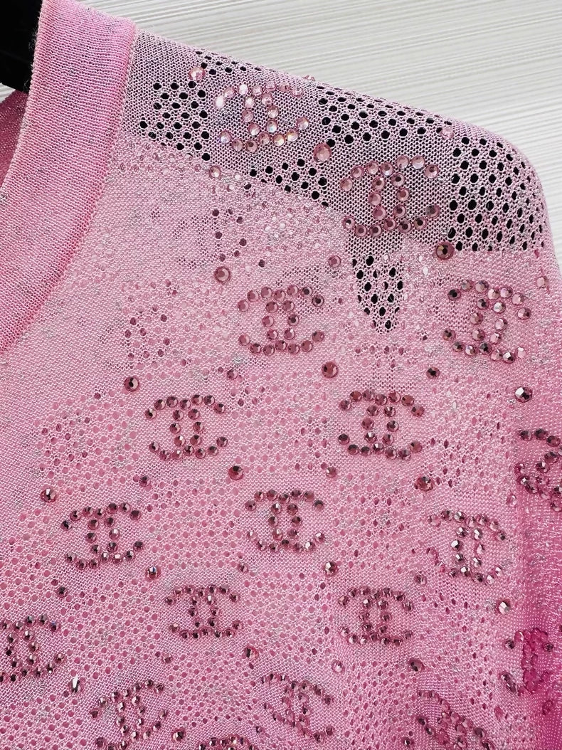 Chanel 23p pink top adorned with CC logo and rhinestones