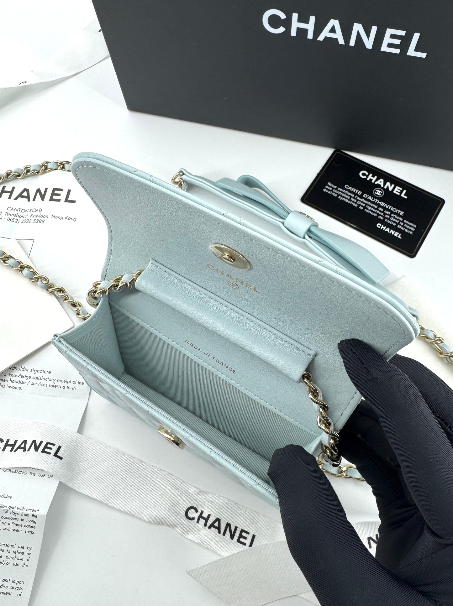 Chanel baby blue quilted leather coin purse with gold chain strap and a bow