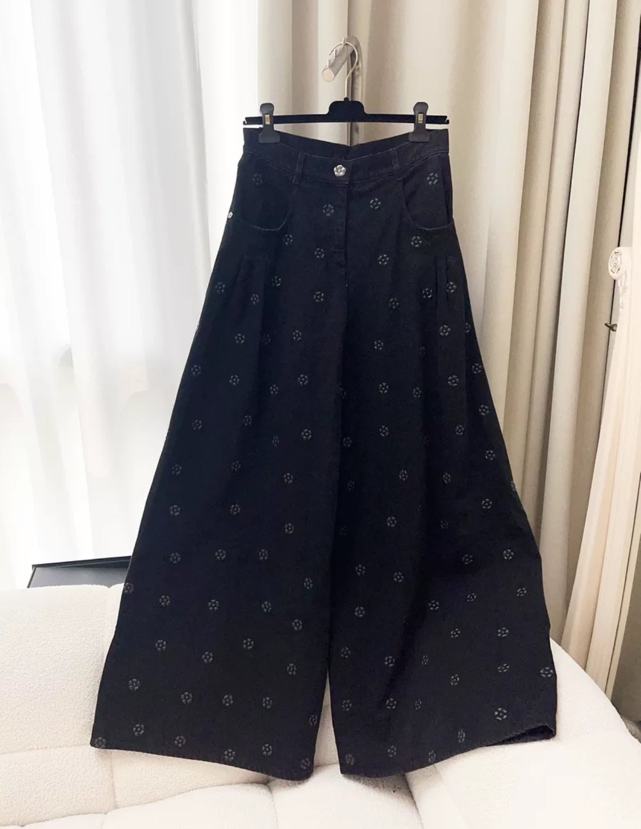 Chanel 23K black camellia wide-leg denim pants