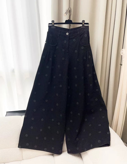 Chanel 23K black camellia wide-leg denim pants