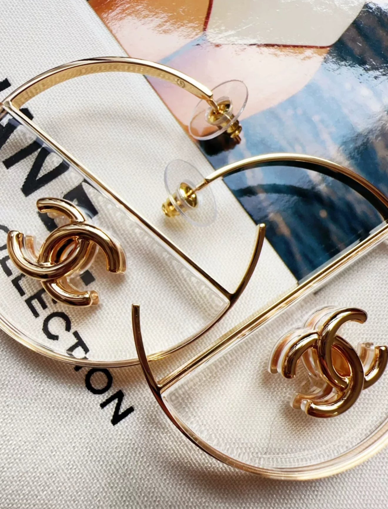 Chanel 23S gold double C transparent acrylic hoop earrings