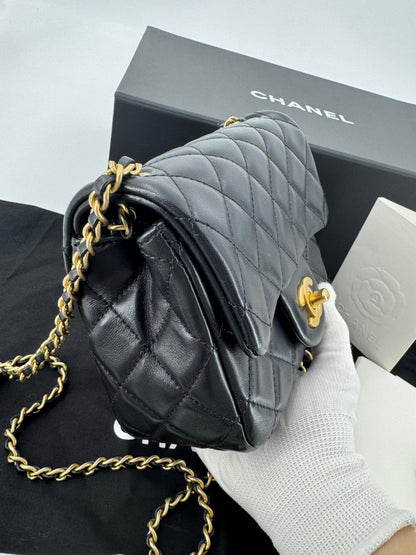 Chanel black mini flap bag with gold hardware