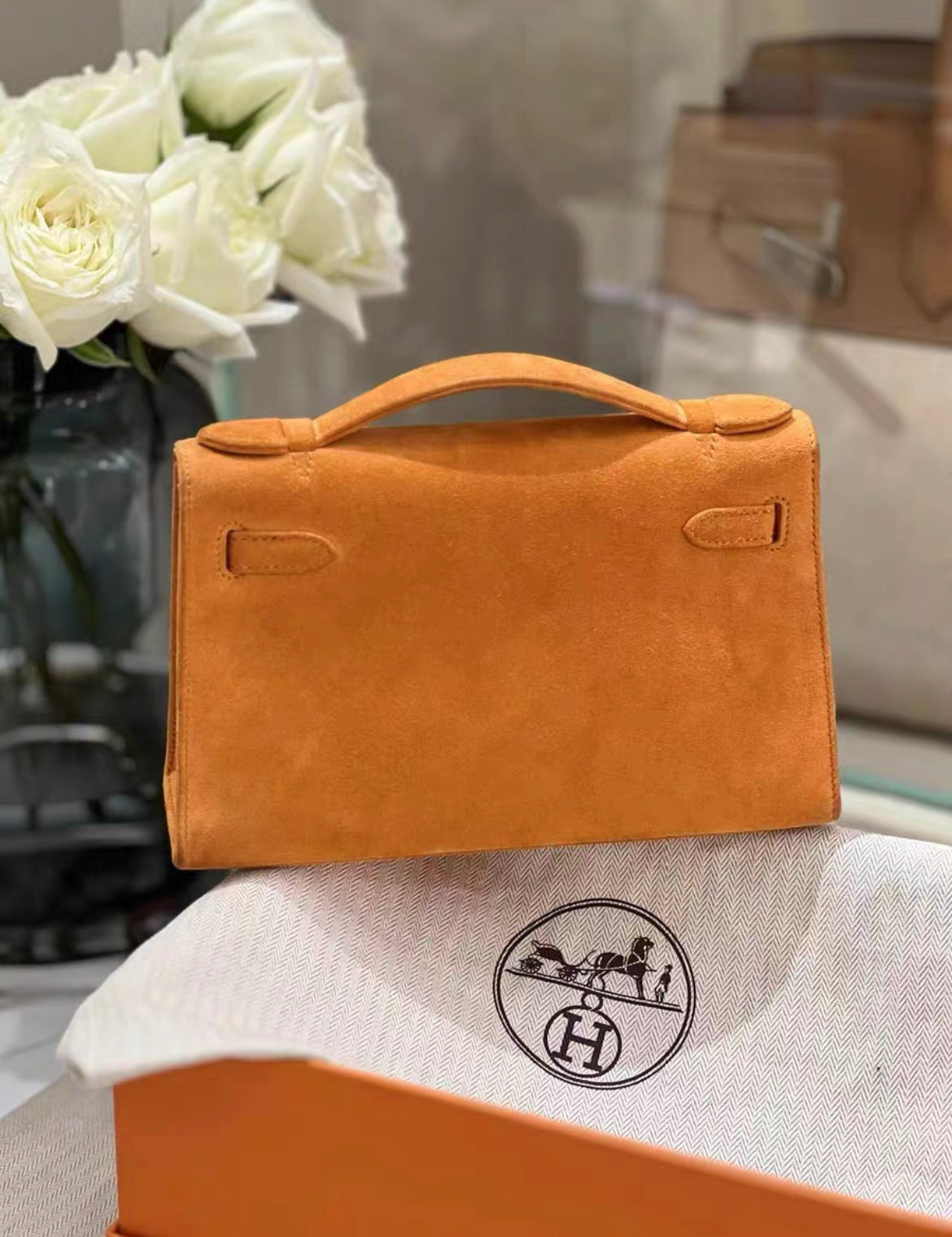 HERMES Veau Doblis Kelly Pochette Orange