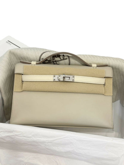 Hermès Kelly pochette Nata / Blanc paired with Craie Swift Leather with Palladium Hardware