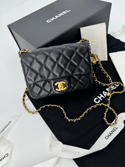 Chanel black mini flap bag with gold hardware