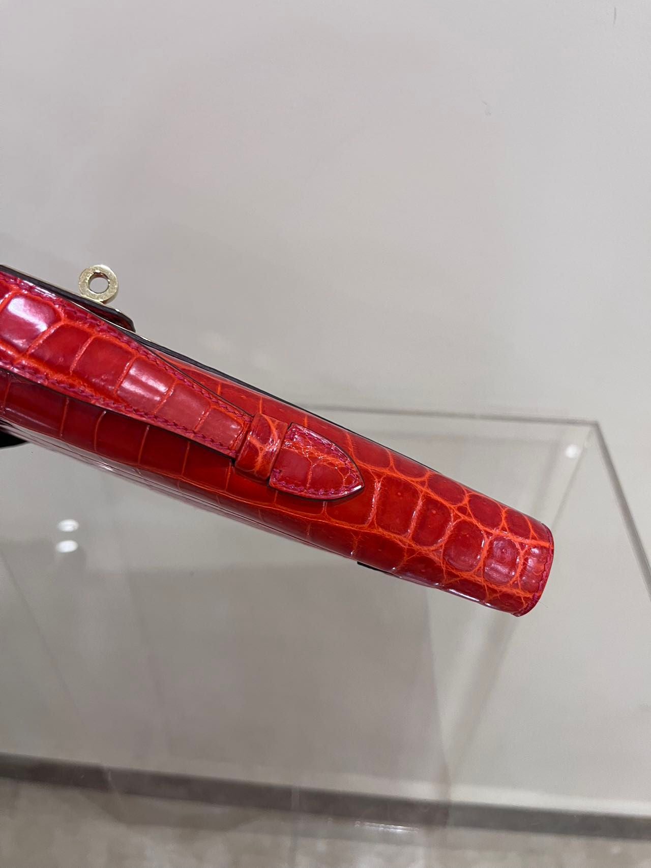 Hermes Kelly cut red shiny crocodile leather gold hardware