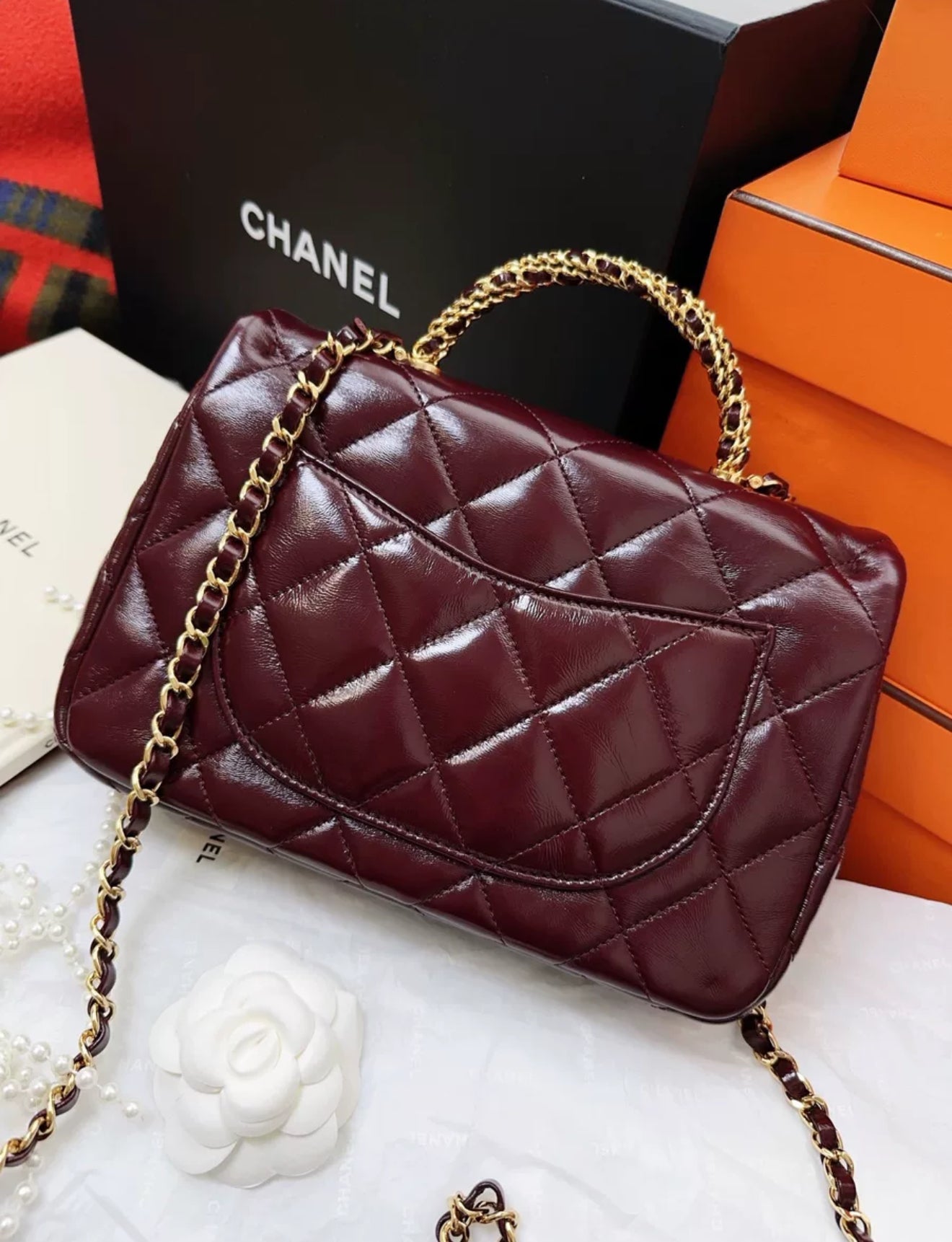 Chanel 24b burgundy sheepskin leather with gold chain top handle