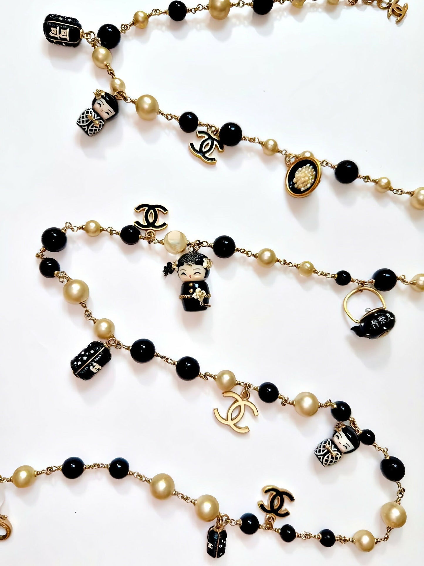Chanel Vintage Shanghai Doll CC Necklace.