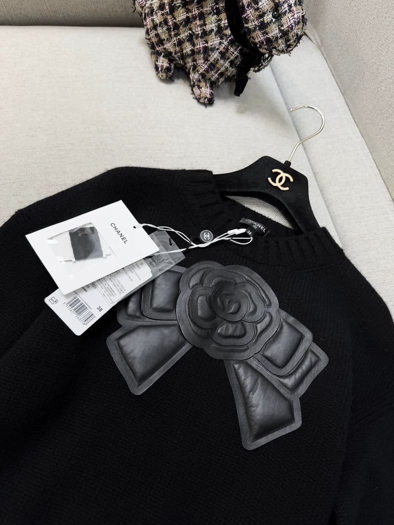 Chanel 20k black leather camellia bow knit top