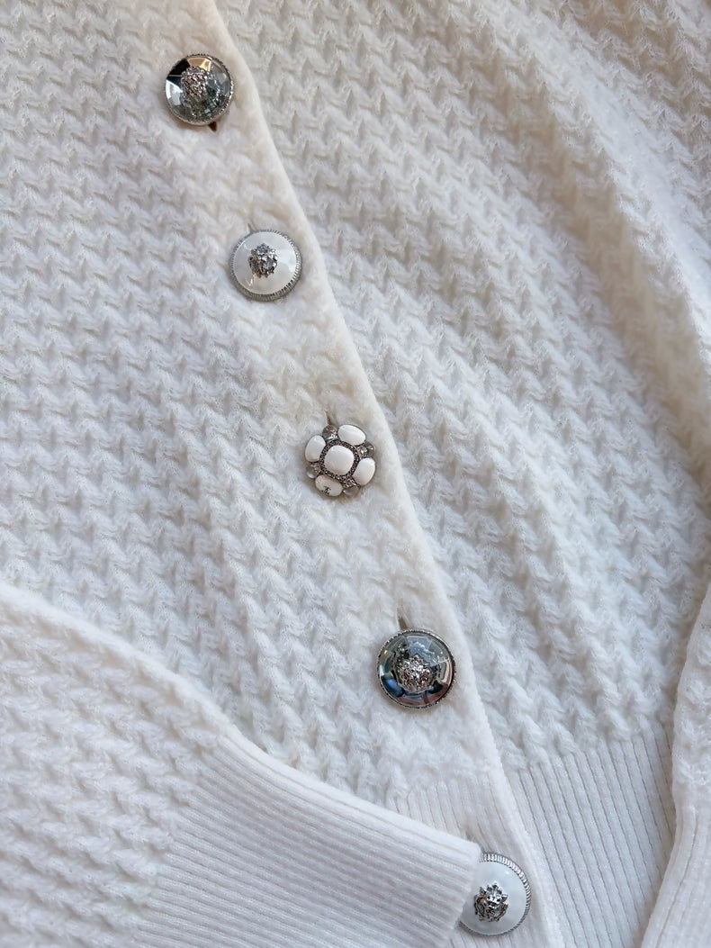 Chanel 24A white cashmere cardigan with charms buttons