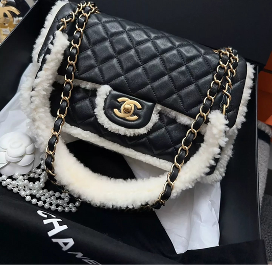 Chanel 21A black leather and white shearling flap bag