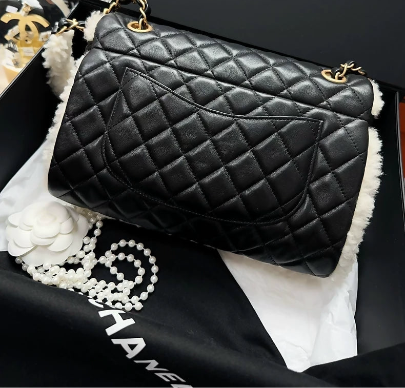 Chanel 21A black leather and white shearling flap bag