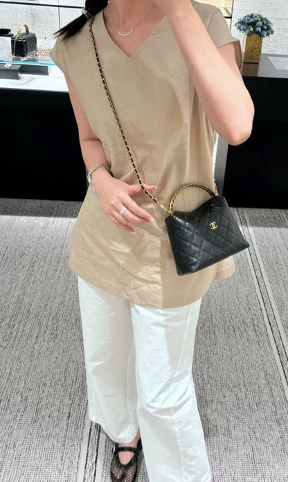 Chanel 24A black leather gold hardware top handle bag