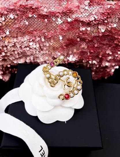 Chanel Autumn 2021 Number 5 Brooch With Faux Pearl and Colored Strass