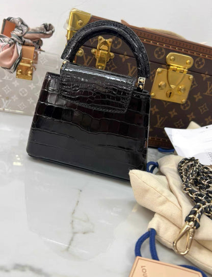 LOUIS VUITTON BLACK MINI CAPUCINES BB HANDBAG IN SHINY CROCODILE LEATHER WITH GOLD HARDWARE