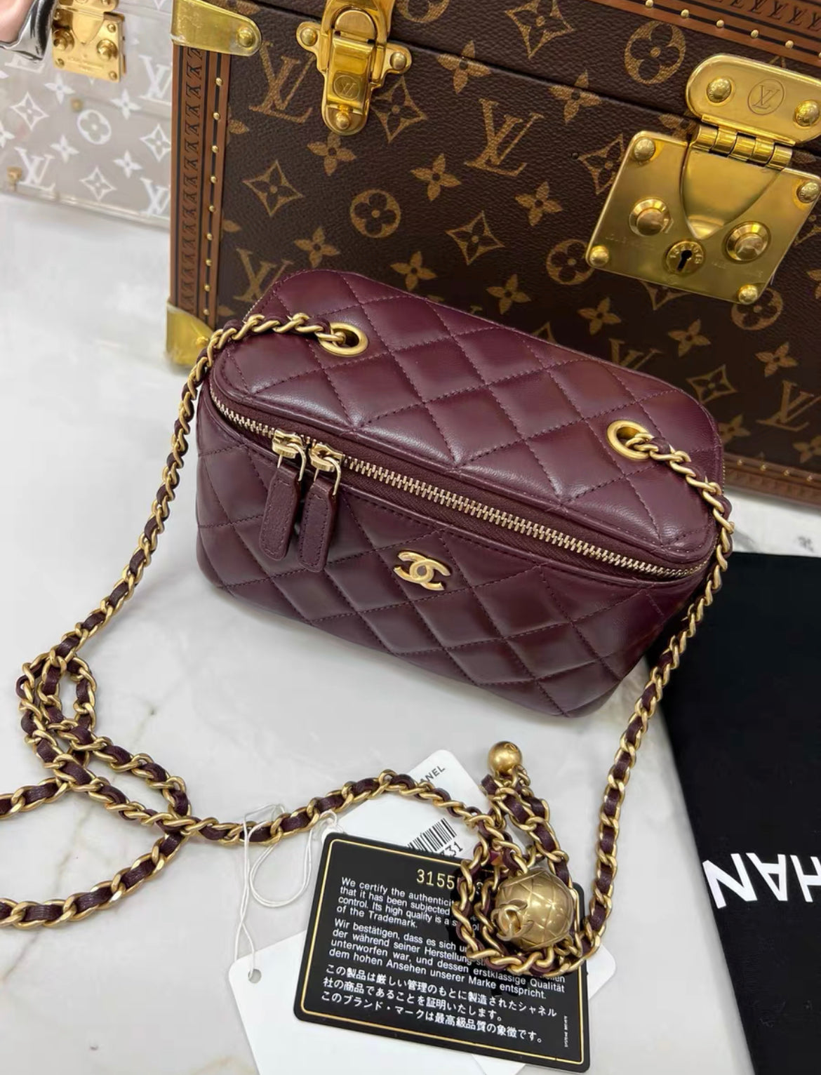 Chanel gold ball mini case chain bag in burgundy