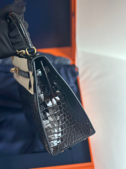 Hermès Kelly Midas 25 Noir Shiny Crocodile Porosus 18k yellow gold hardware & handle