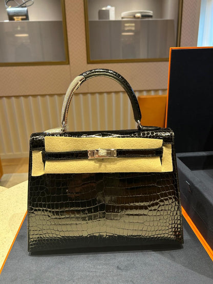 HERMES KELLY 25 MIDAS SHINY BLACK POROSUS CROCODILE SELLIER WITH 18K WHITE GOLD HARDWARE & DIAMOND HANDLE