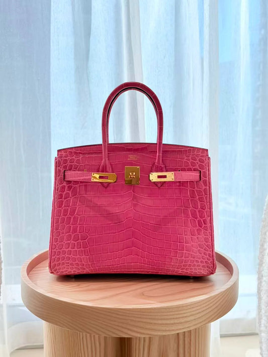 HERMÈS Birkin 30 Rose Tyrien Shiny Niloticus Crocodile Gold hardware