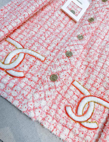 Chanel 24P pink and white double C pocket jacket
