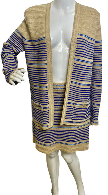 From the 2019 Cruise Resort La Pausa Collection by Karl Lagerfeld. Set Retail 5.5k Chanel Outfit in Metallic Striped Cardigan in Gold, Beige, and Blue Striped Linen Cashmere Blend with Matching Skirt. 2 Gold CC Buttons on Pockets and 2 on the skirt with