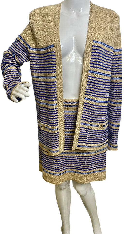 From the 2019 Cruise Resort La Pausa Collection by Karl Lagerfeld. Set Retail 5.5k Chanel Outfit in Metallic Striped Cardigan in Gold, Beige, and Blue Striped Linen Cashmere Blend with Matching Skirt. 2 Gold CC Buttons on Pockets and 2 on the skirt with