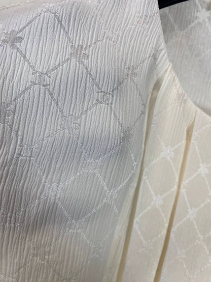 Chanel 21A beige quilted logo silk top