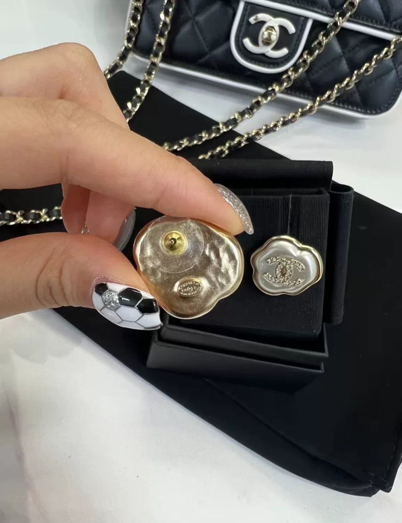 Chanel 25A mother-of-pearl cloud earrings