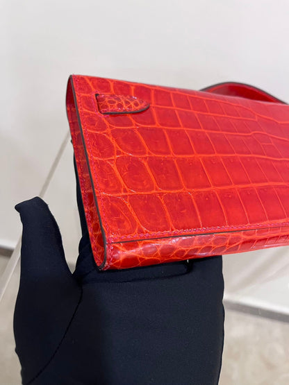 Hermes Kelly cut red shiny crocodile leather gold hardware