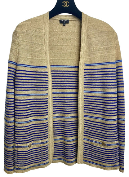 From the 2019 Cruise Resort La Pausa Collection by Karl Lagerfeld. Set Retail 5.5k Chanel Outfit in Metallic Striped Cardigan in Gold, Beige, and Blue Striped Linen Cashmere Blend with Matching Skirt. 2 Gold CC Buttons on Pockets and 2 on the skirt with