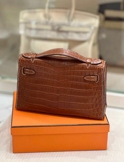 HERMÈS KELLY POCHETTE FAUVE BARÉNIA NILOTICUS CROCODILE PALLADIUM HARDWARE