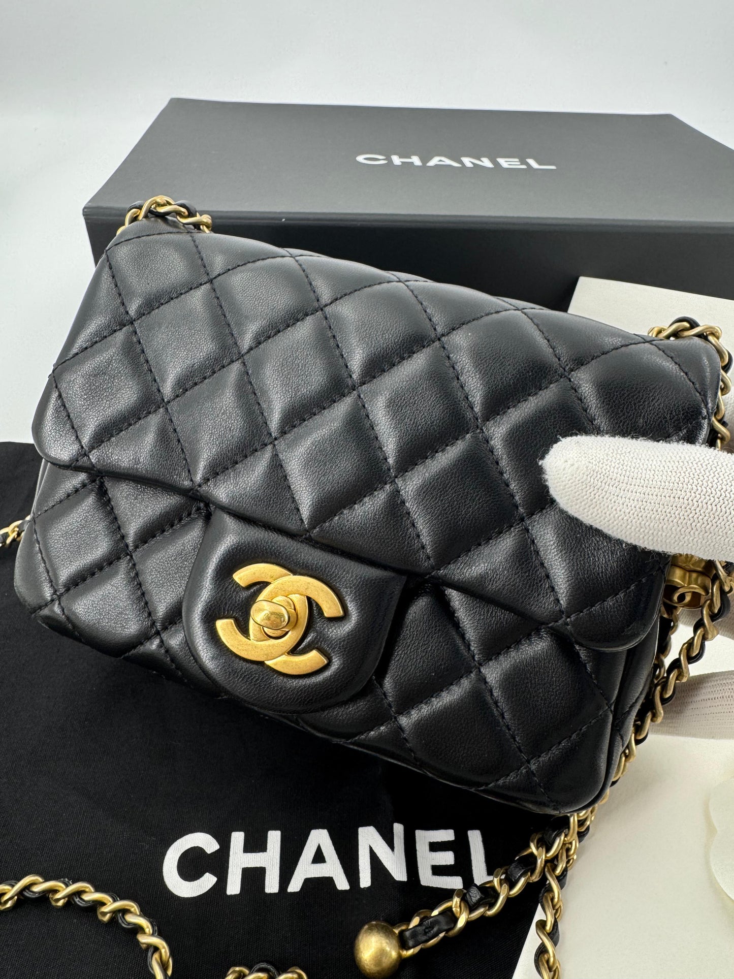 Chanel black mini flap bag with gold hardware