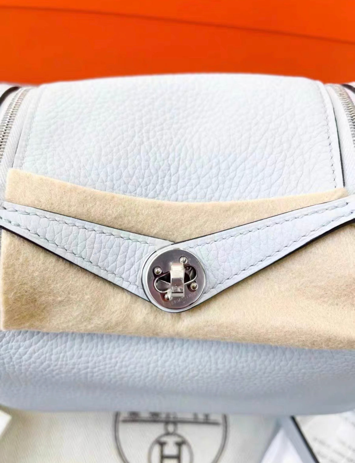 HERMÈS Mini Lindy shoulder bag in Bleu Pale Taurillon Clemence leather with Palladium hardware