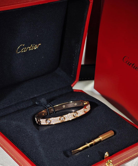 Cartier LOVE Bracelet in 18k rose gold with pavé of diamonds - size 17