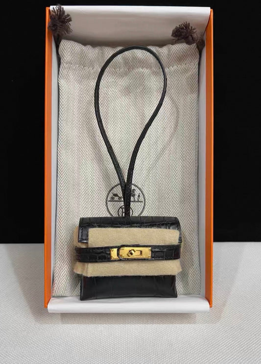 Hermès Kelly festival charm in matte crocodile leather gold hardware