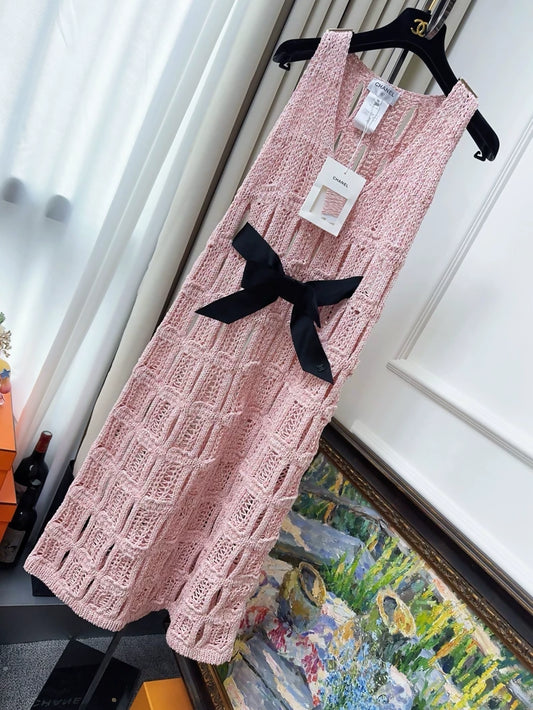 Chanel Spring/Summer 2025 dress in pink knit with black bow belt