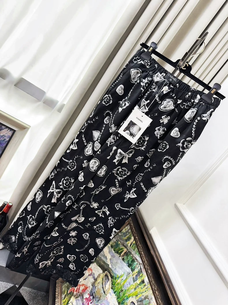 Chanel 25B Black Heart Bow Multi-element Print Lace Pants