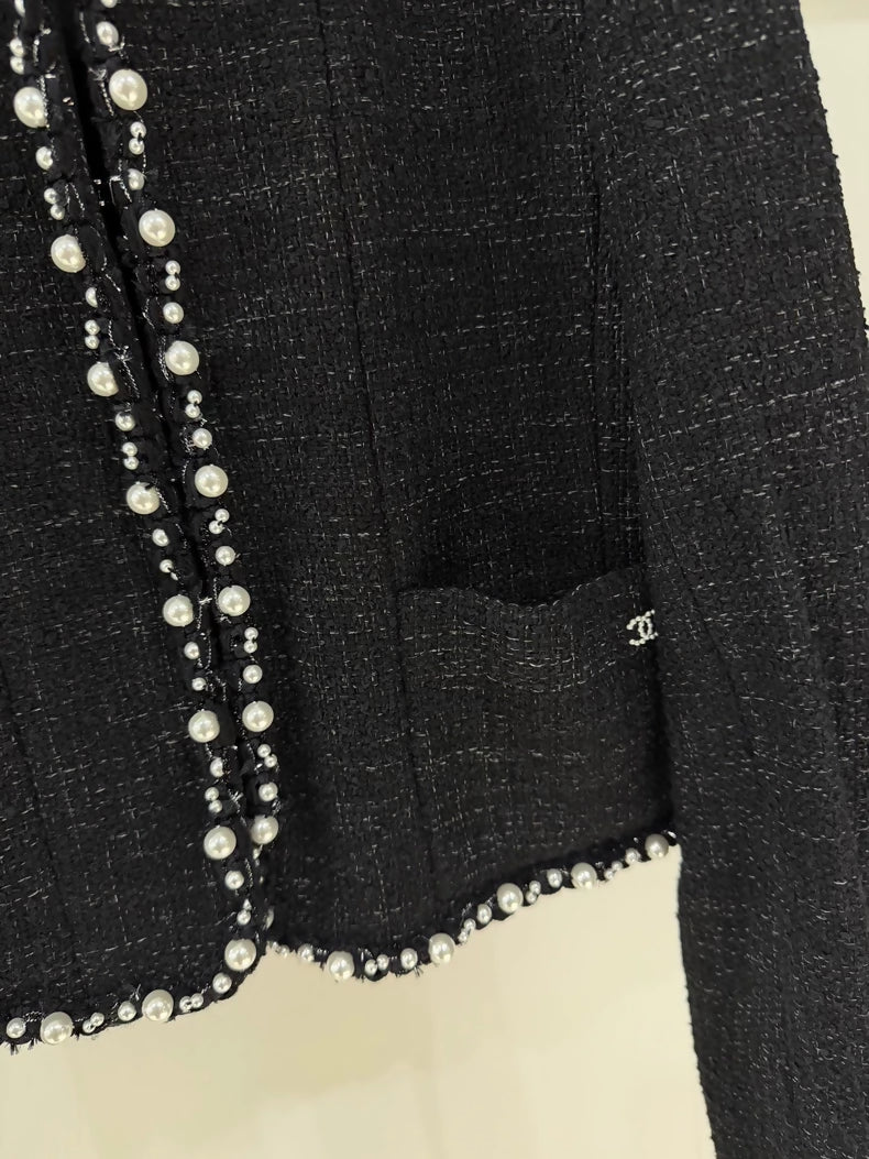 Chanel 25P pearl-trimmed black jacket