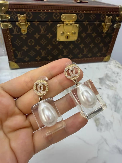 Chanel 19K gold pearl and acrylic earrings
