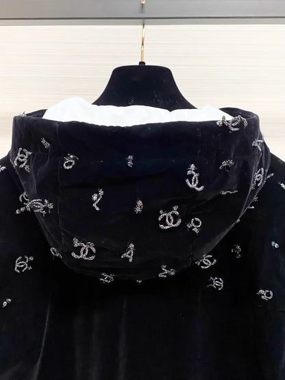Chanel ski collection, velvet embroidered logo hooded down jacket