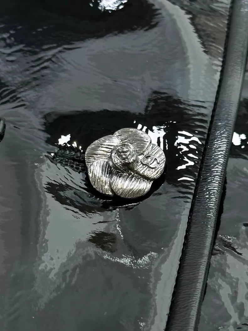 Chanel 23K Black Patent Leather Camellia Button Short Jacket