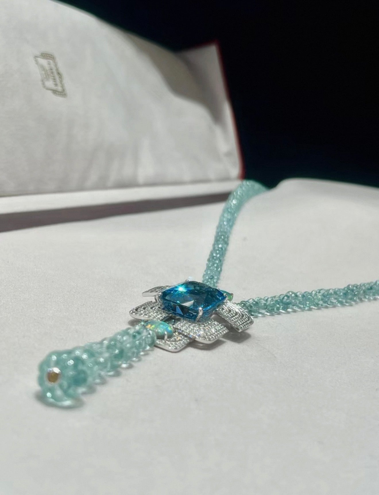 Cartier High Jewelry Necklace - Main stone: 37-carat aquamarine; two opals; chain beads: topaz.