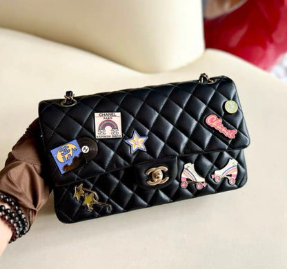 Chanel 24C Flap Bag in Black Leather Embellished with Charms